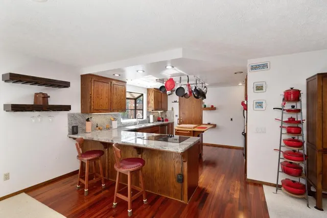 a bathroom with a shower and a sink