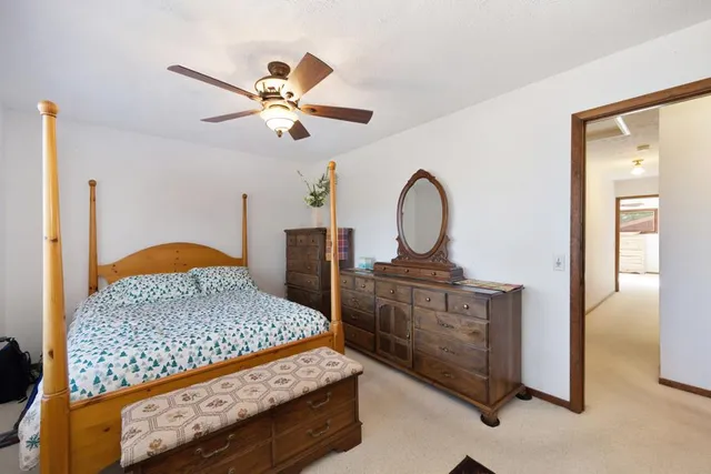 a view of a two chairs in the balcony