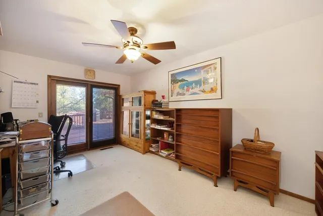 a front view of a house with yard and seating space