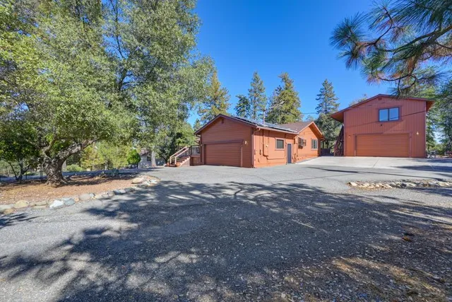 a view of a patio with table and chairs and wooden floor
