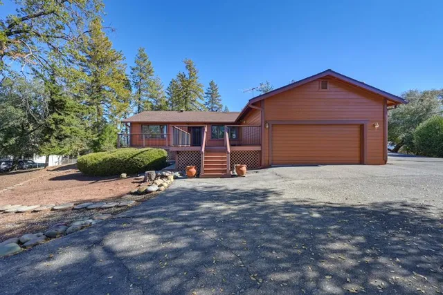 a view of a chairs and table in the patio