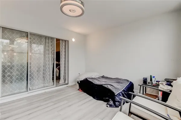 a bed room with a bed and a window