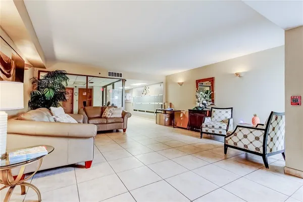 a living room with furniture and a table