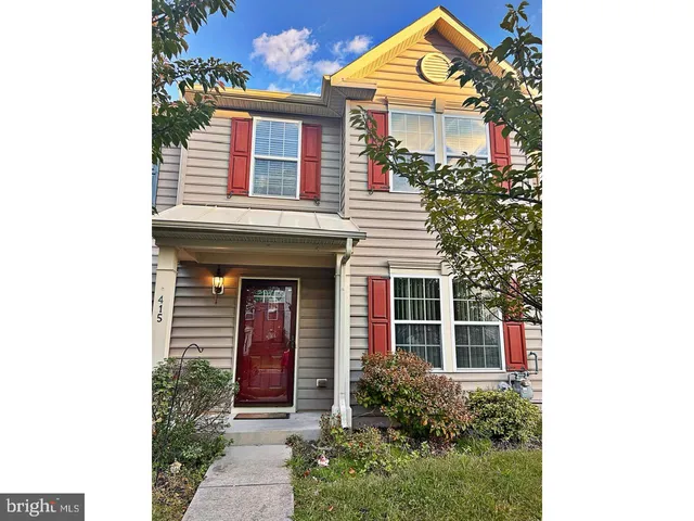 a front view of a house with a porch