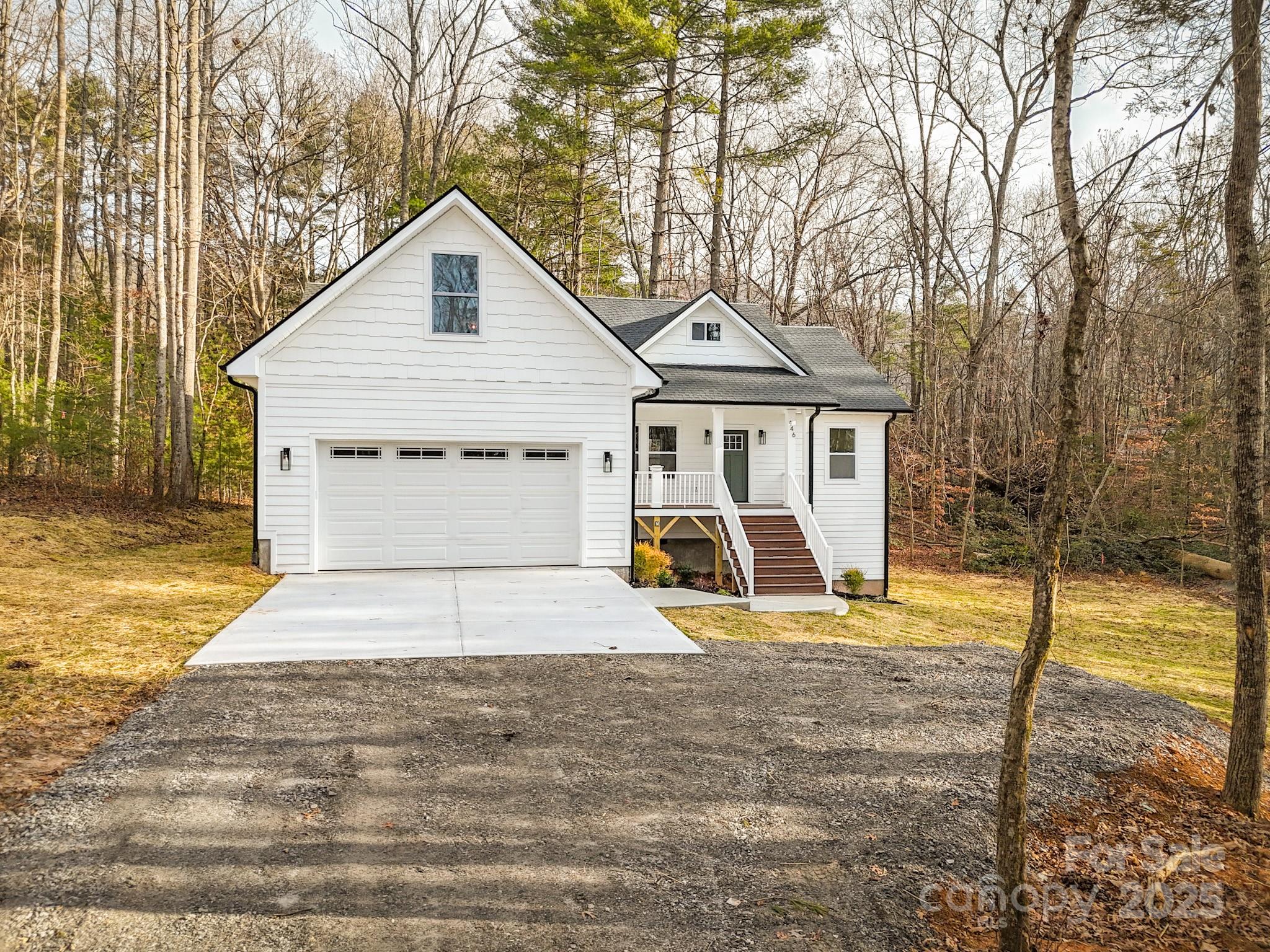 446 Old Buckeye Cove Road Swannanoa, NC 28778 - Photo 1 of 48 a view of a house with a yard and fence
