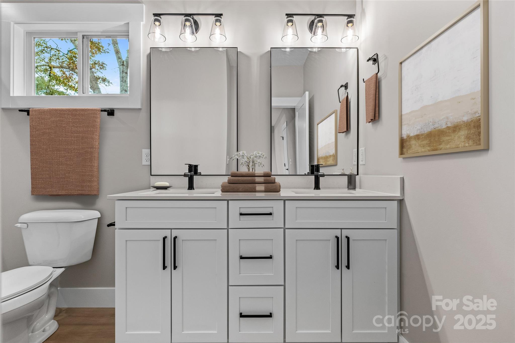 446 Old Buckeye Cove Road Swannanoa, NC 28778 - Photo 35 of 48 a bathroom with a granite countertop toilet sink and mirror