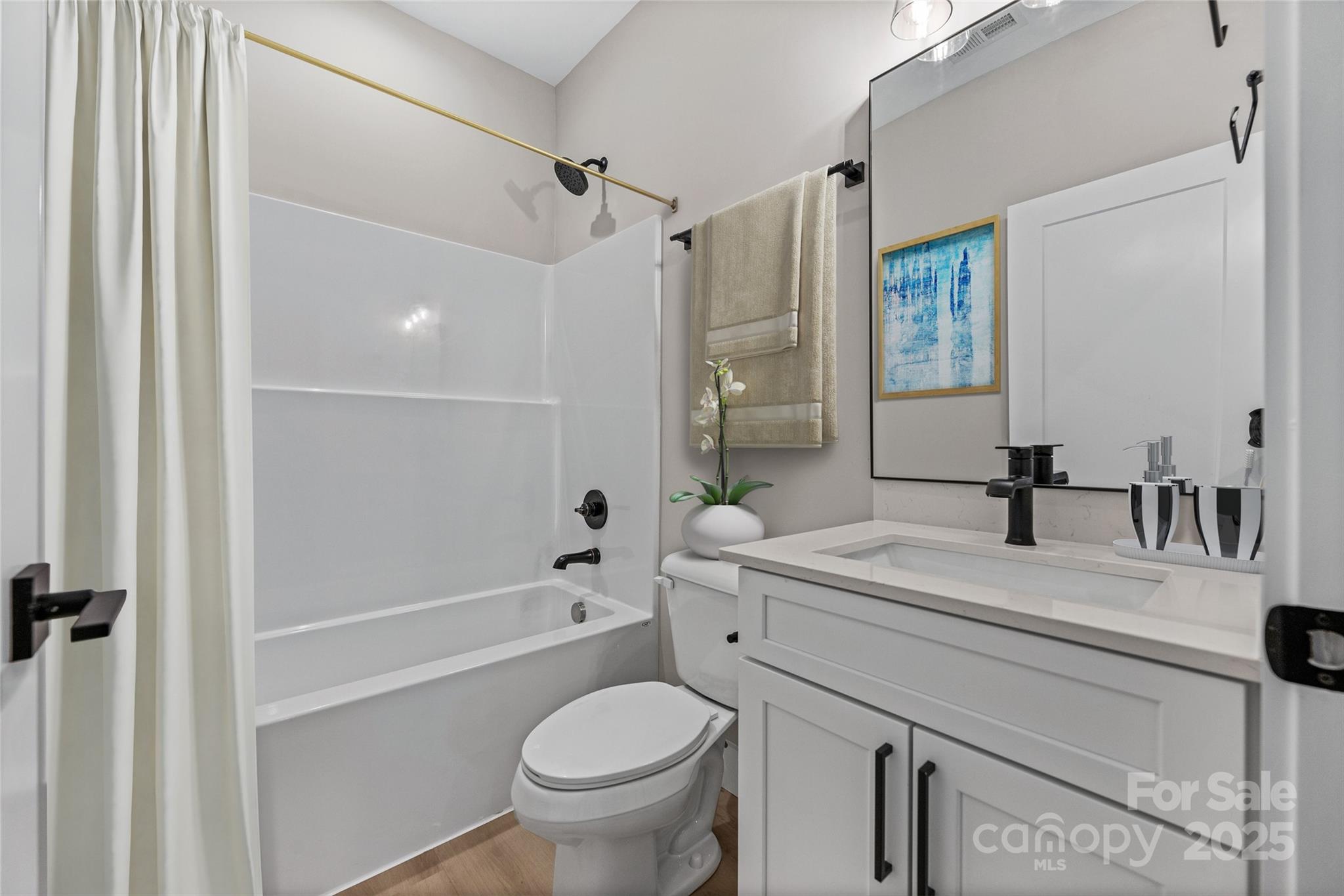 446 Old Buckeye Cove Road Swannanoa, NC 28778 - Photo 41 of 48 a bathroom with a sink toilet vanity and shower