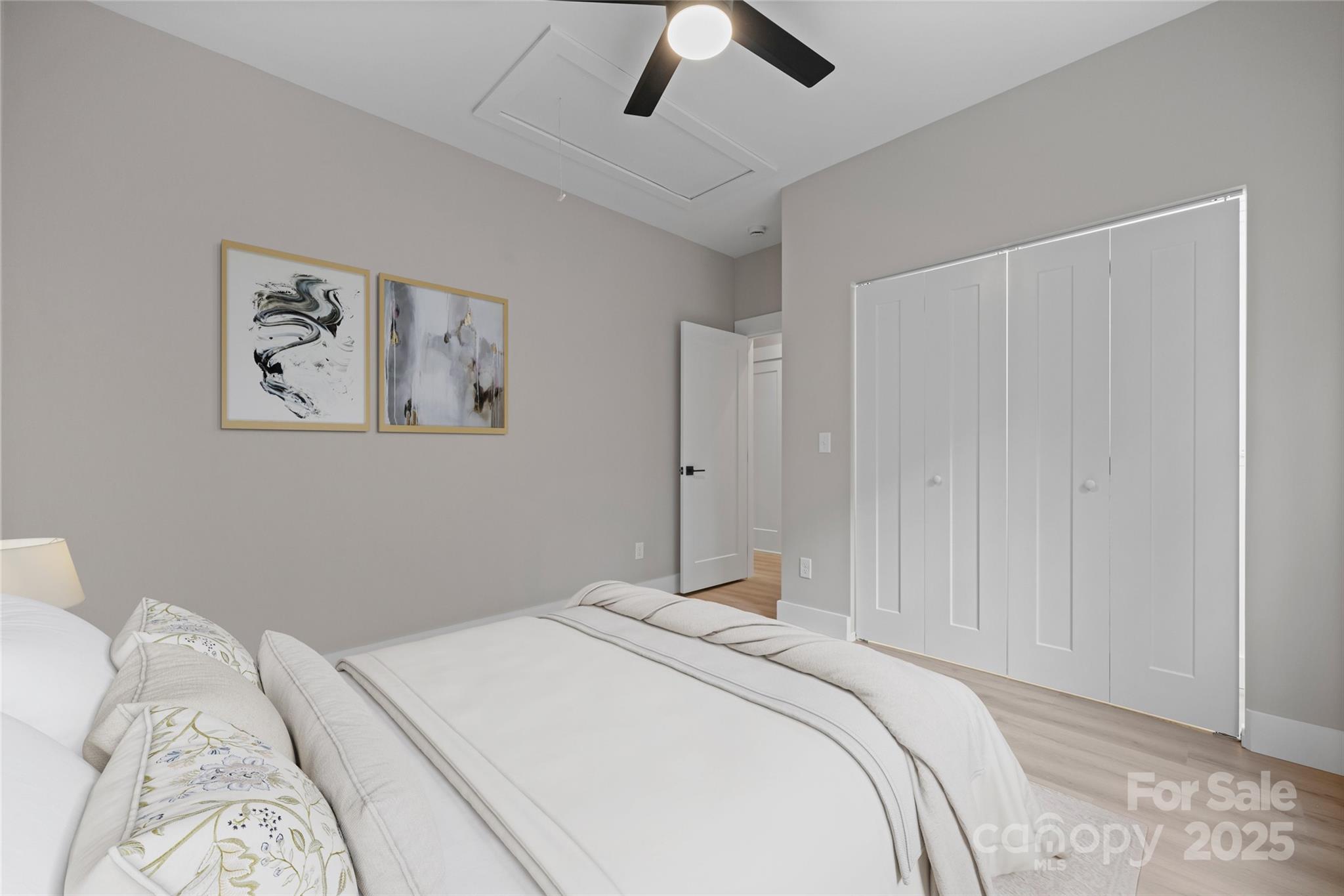 446 Old Buckeye Cove Road Swannanoa, NC 28778 - Photo 45 of 48 a bedroom with a bed and a painting on the wall