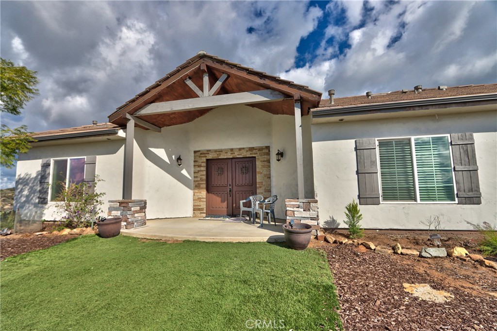 40105 Voyager Road Hemet, CA 92544 - Photo 2 of 27 a front view of a house with a yard