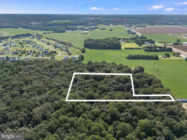 an aerial view of a house with a garden