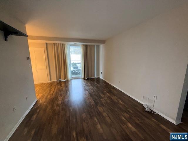 458 River Road Nutley, NJ 07110 - Photo 6 of 13 an empty room with wooden floor and windows