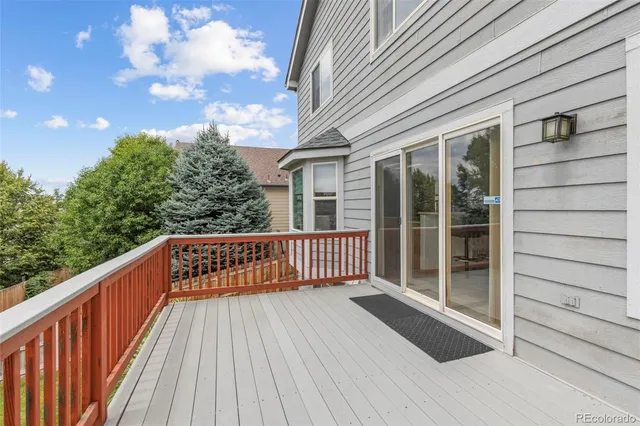 a view of balcony with wooden floor