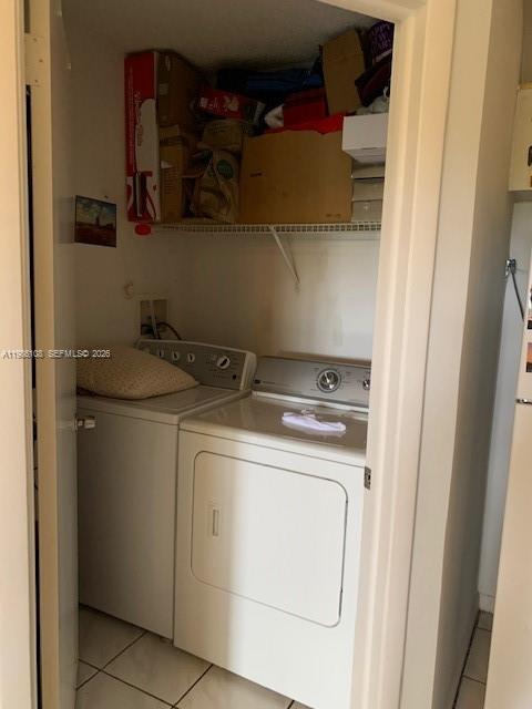 513 Racquet Club Road, Unit 55 Weston, FL 33326 - Photo 20 of 25 a utility room with dryer and washer
