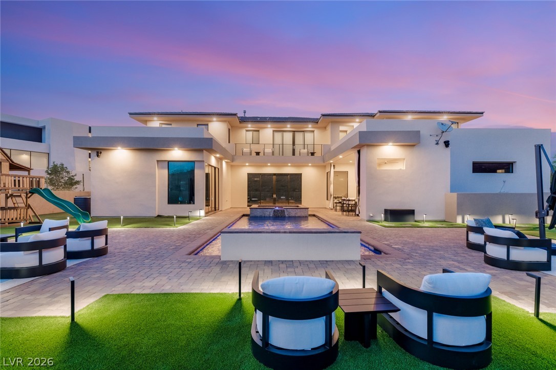 5 Crystal Tree Pass Henderson, NV 89052 - Photo 54 of 67 A lavish outdoor space, with a contemporary pool and playful recreation amenities, sets the scene for entertaining.
