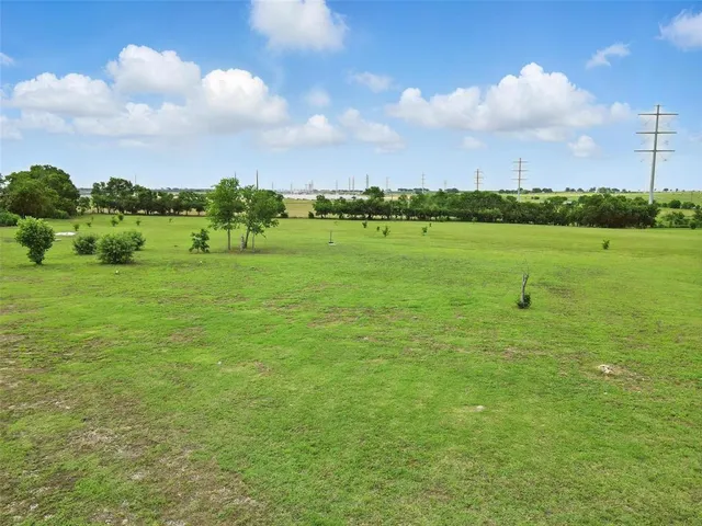 a view of a lake and a yard