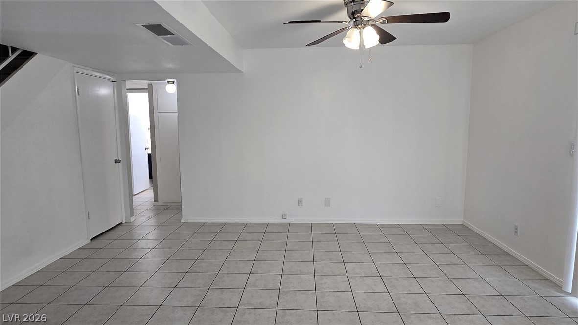 3849 Reflection Way Las Vegas, NV 89147 - Photo 9 of 25 This living area features durable tile flooring, providing an easy-to-maintain foundation for any decor.