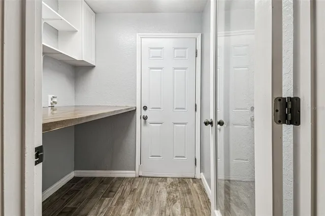 a view of a city with lots of houses and lake view