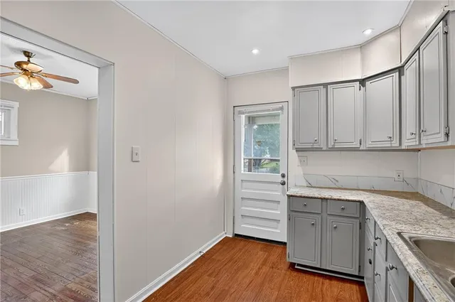 a view of a kitchen with electric appliances