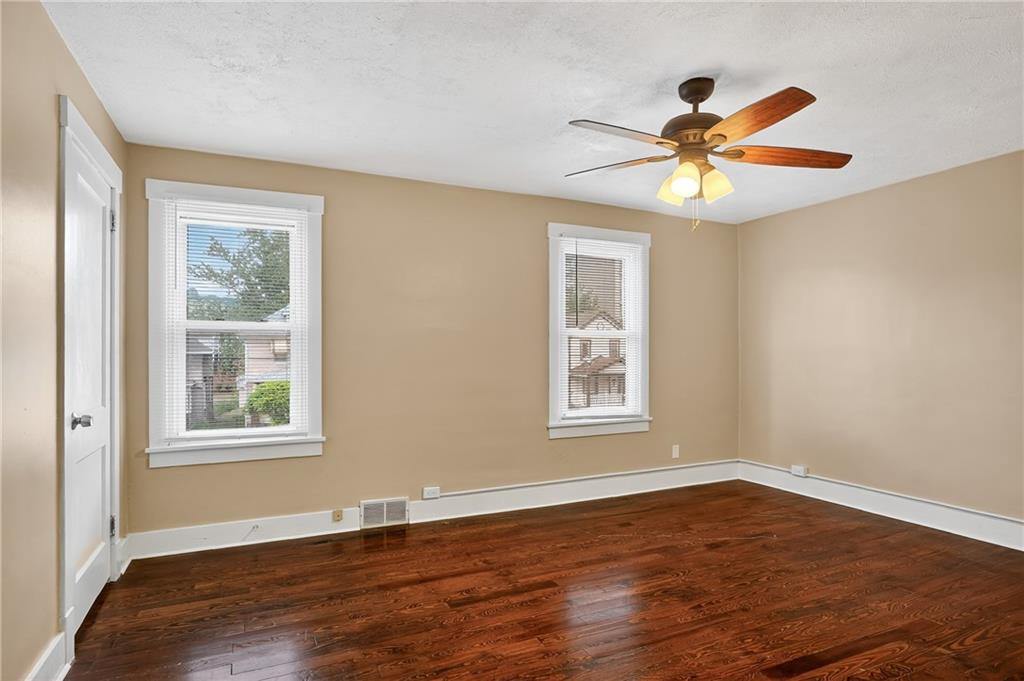 924 1st Coraopolis, PA 15108 - Photo 15 of 34 a view of an empty room with wooden floor and a window
