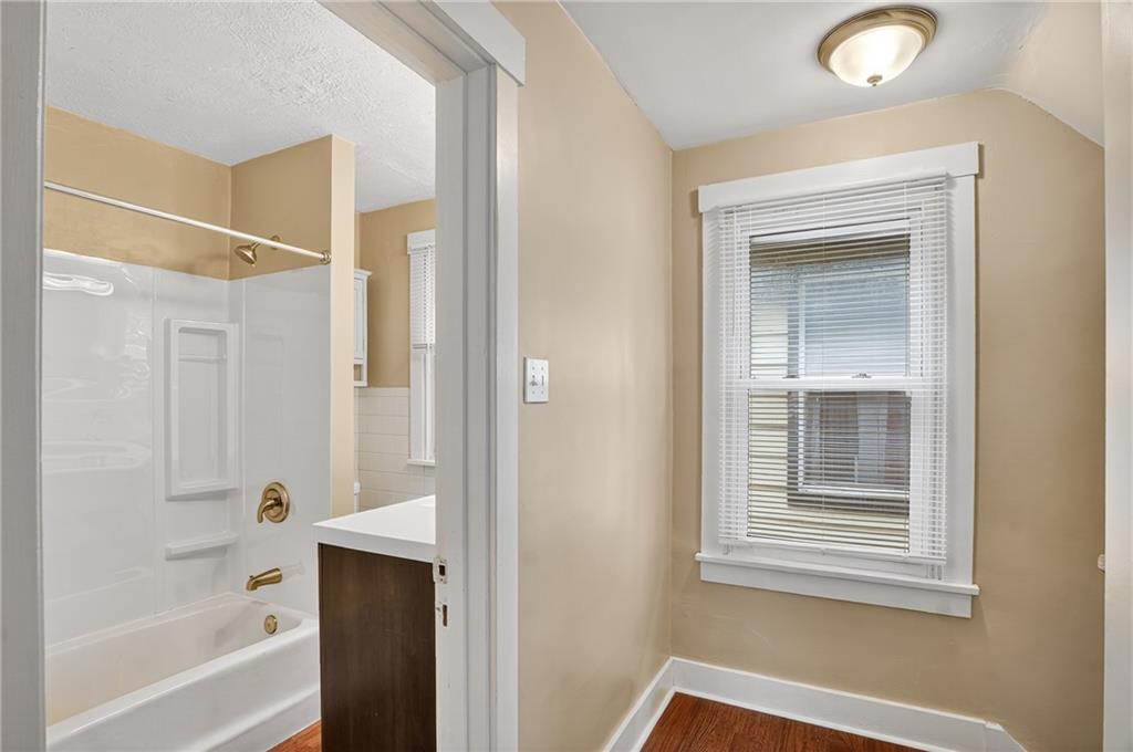 924 1st Coraopolis, PA 15108 - Photo 18 of 34 a bathroom with a bathtub and a shower