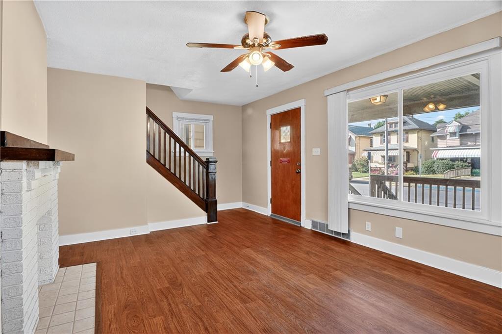 924 1st Coraopolis, PA 15108 - Photo 2 of 34 a view of an empty room with wooden floor and a window