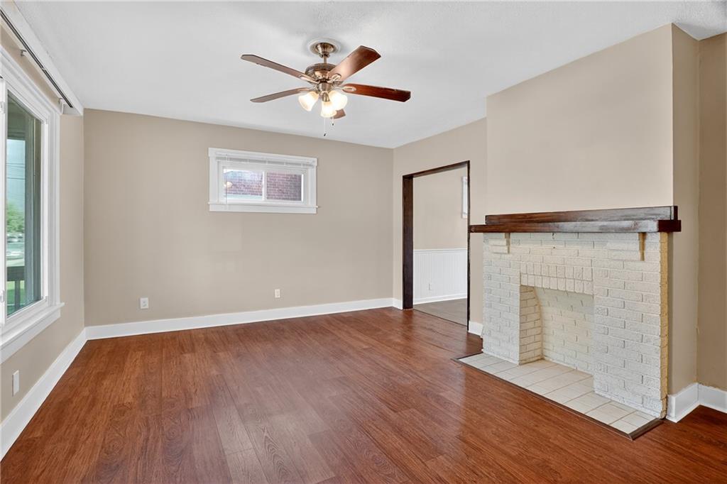924 1st Coraopolis, PA 15108 - Photo 3 of 34 a view of an empty room with wooden floor and a window