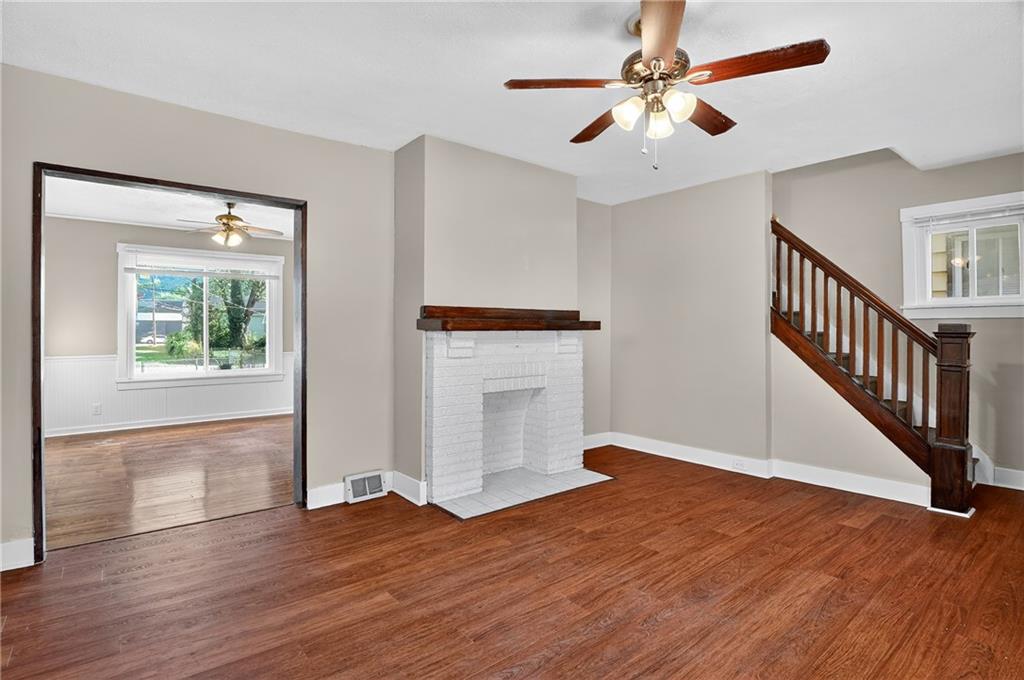 924 1st Coraopolis, PA 15108 - Photo 4 of 34 an empty room with wooden floor fan and windows