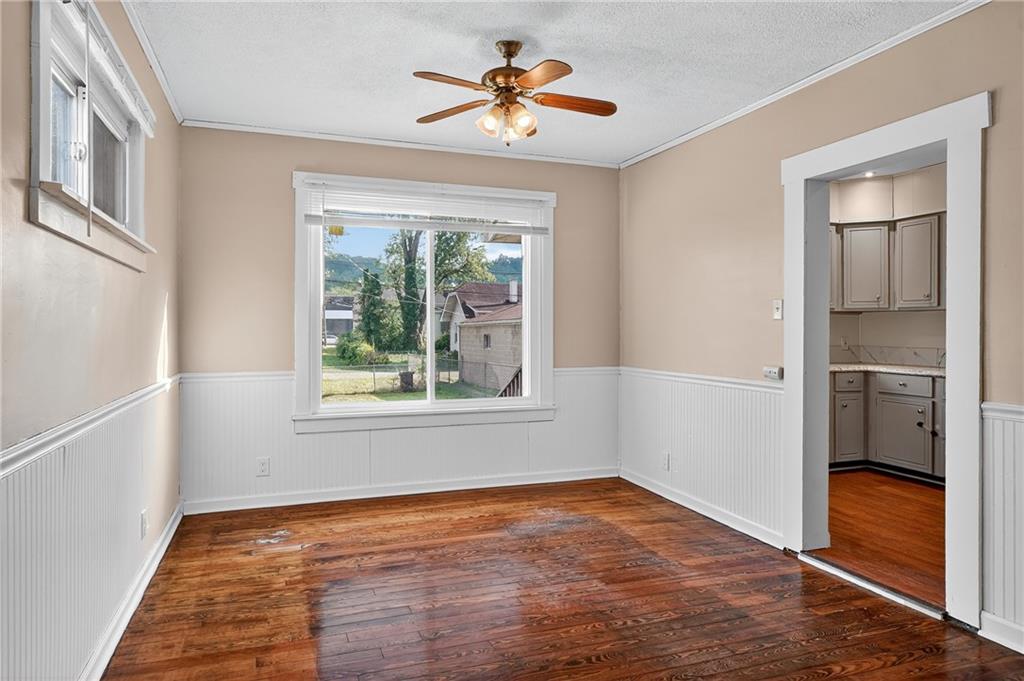 924 1st Coraopolis, PA 15108 - Photo 5 of 34 a view of empty room with wooden floor and fan