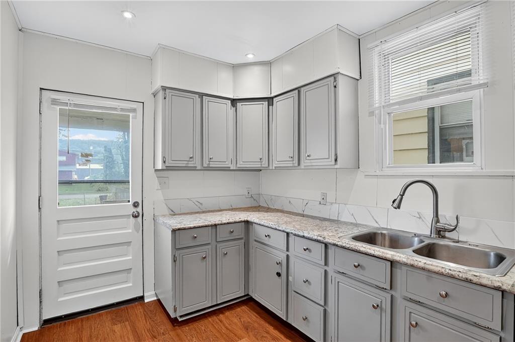 924 1st Coraopolis, PA 15108 - Photo 8 of 34 a kitchen with white cabinets and sink