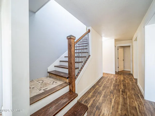 a view of entryway with wooden floor