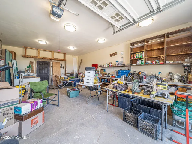 an aerial view of a house with yard