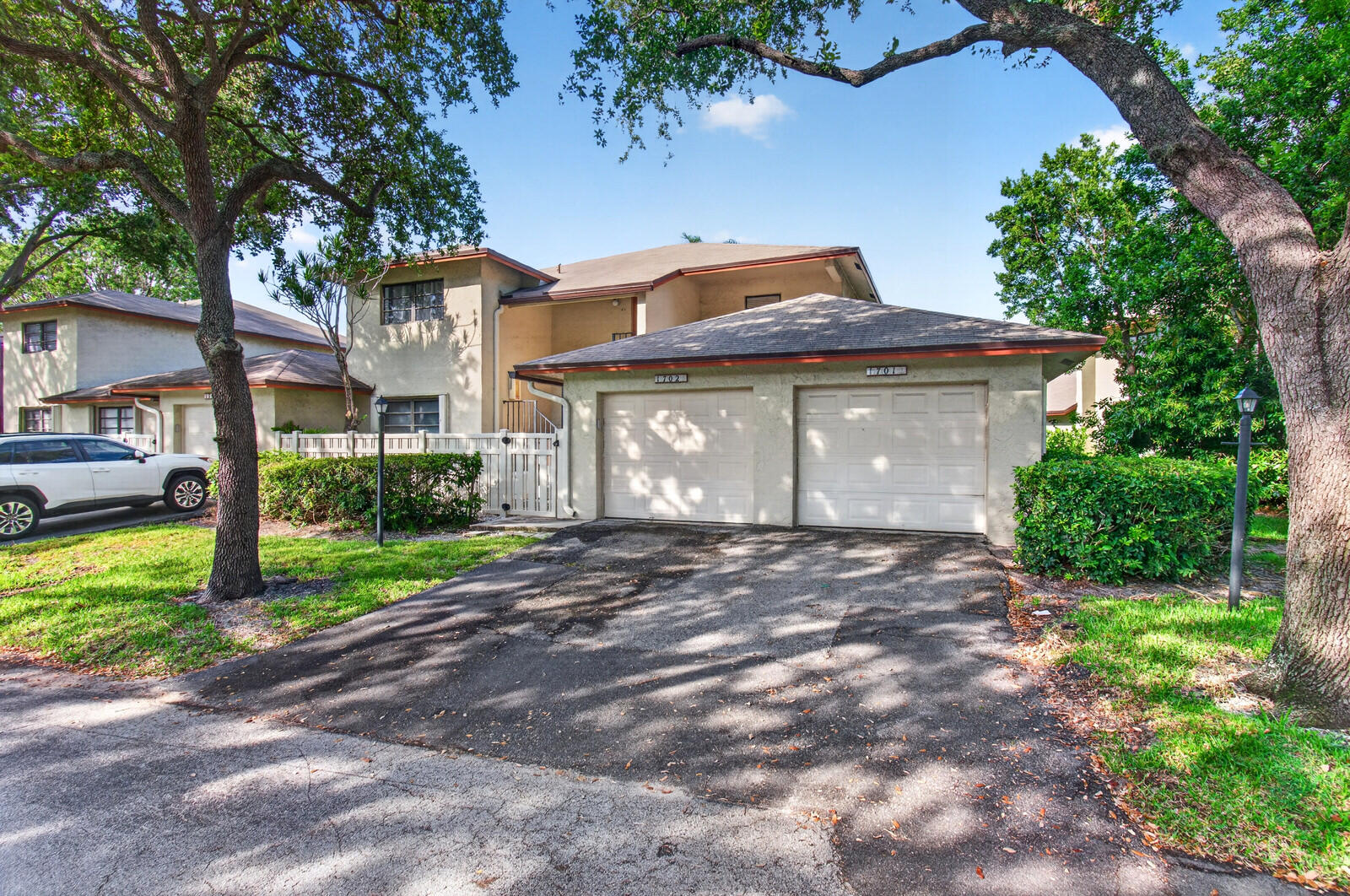 3951 Northeast 19th Road, Unit 1701 Pompano Beach, FL 33064 - Photo 63 of 82 a front view of a house with a garden and plants