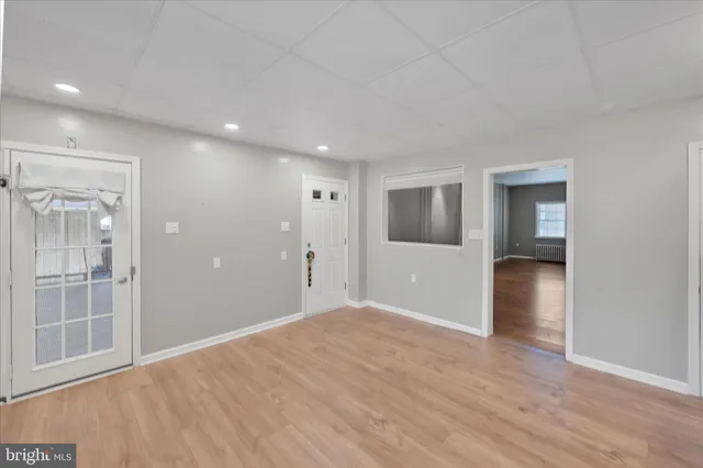a kitchen with a refrigerator and a stove top oven