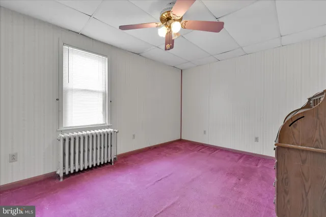 a view of a bathroom from a hallway