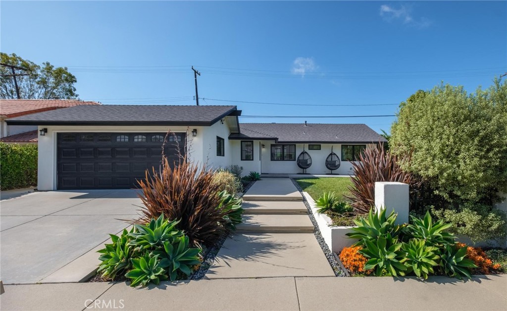28405 Golden Meadow Drive Rancho Palos Verdes, CA 90275 - Photo 11 of 42 a front view of a house with garden