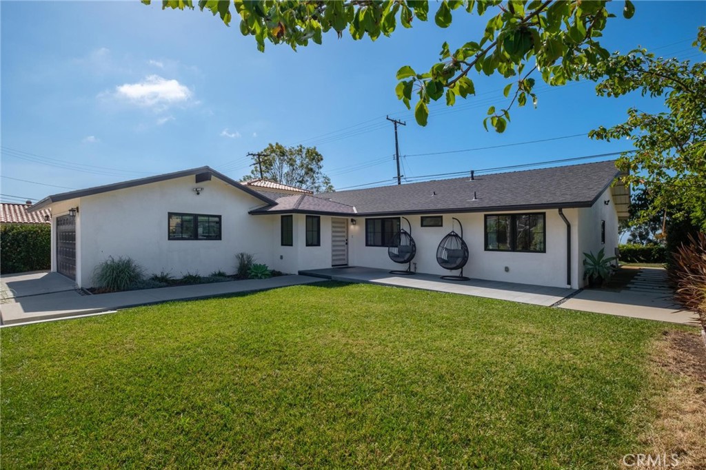 28405 Golden Meadow Drive Rancho Palos Verdes, CA 90275 - Photo 13 of 42 a front view of a house with a garden