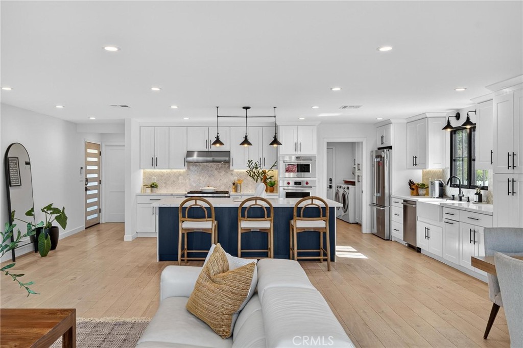28405 Golden Meadow Drive Rancho Palos Verdes, CA 90275 - Photo 22 of 42 a large kitchen with stainless steel appliances kitchen island granite countertop a large cabinets a sink and a counter top space