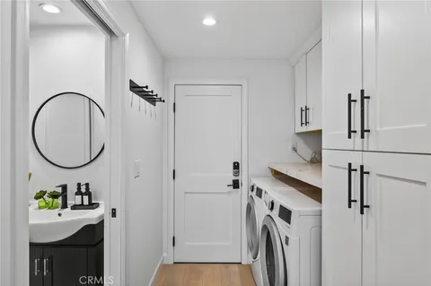 a view of a storage & utility room with washer and dryer