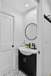 a bathroom with a sink and a mirror