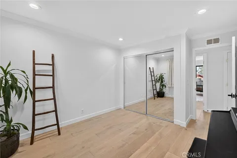 a bedroom with a bed and a view of bathroom