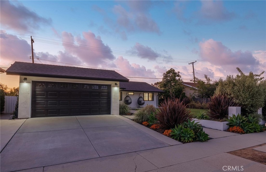 28405 Golden Meadow Drive Rancho Palos Verdes, CA 90275 - Photo 3 of 42 a front view of a house with a yard and garage