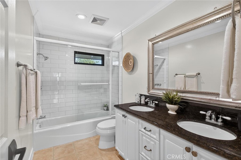 28405 Golden Meadow Drive Rancho Palos Verdes, CA 90275 - Photo 32 of 42 a bathroom with a granite countertop sink mirror toilet and bathtub