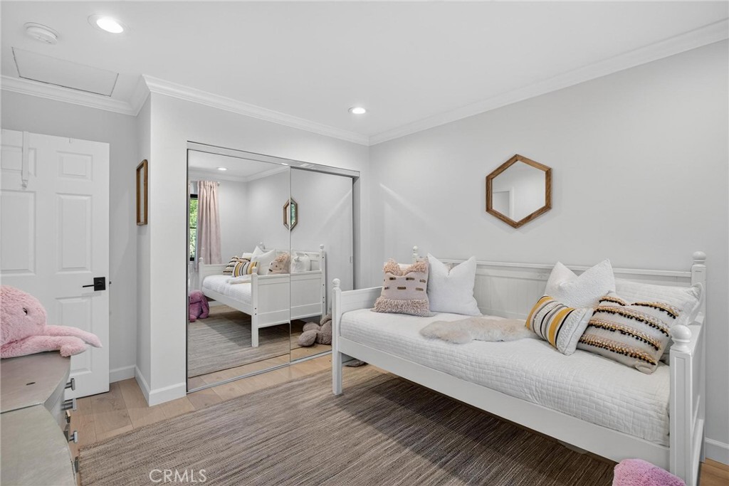 28405 Golden Meadow Drive Rancho Palos Verdes, CA 90275 - Photo 34 of 42 a spacious bedroom with a bed and wooden floor