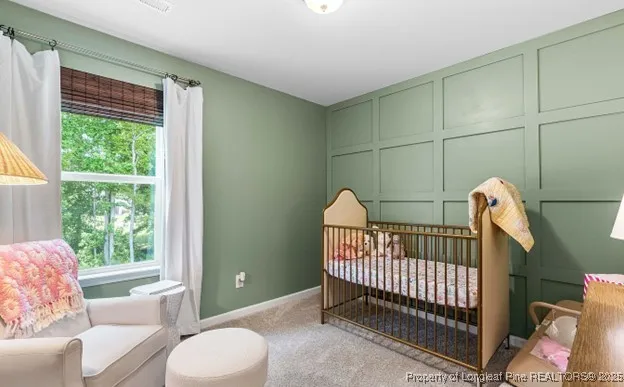 a view of a bedroom with furniture and windows
