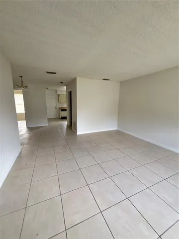 a view of an empty room with a sink