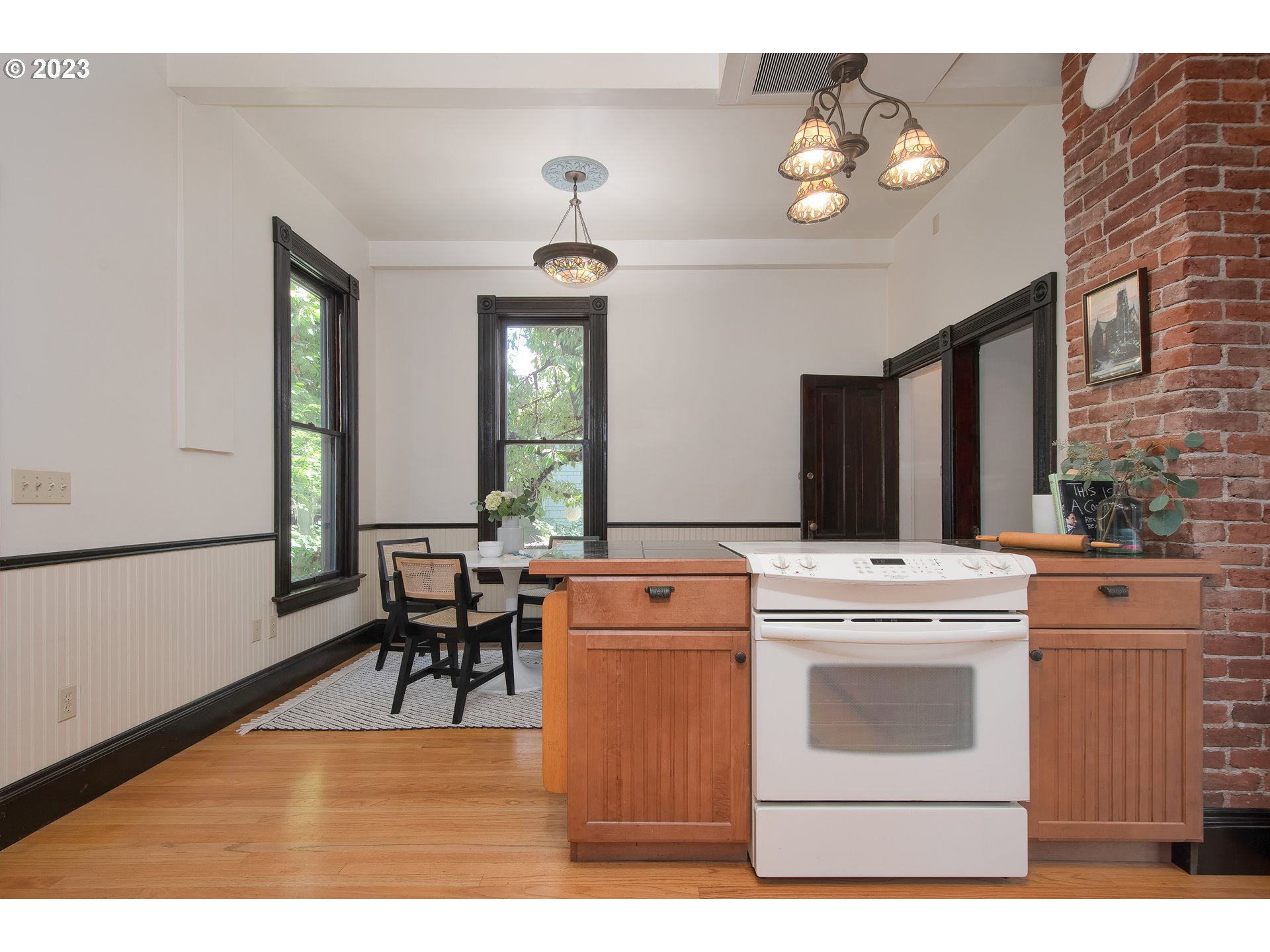 3519 Southeast Morrison Street Portland, OR 97214 - Photo 12 of 43 a view of kitchen with furniture and wooden floor