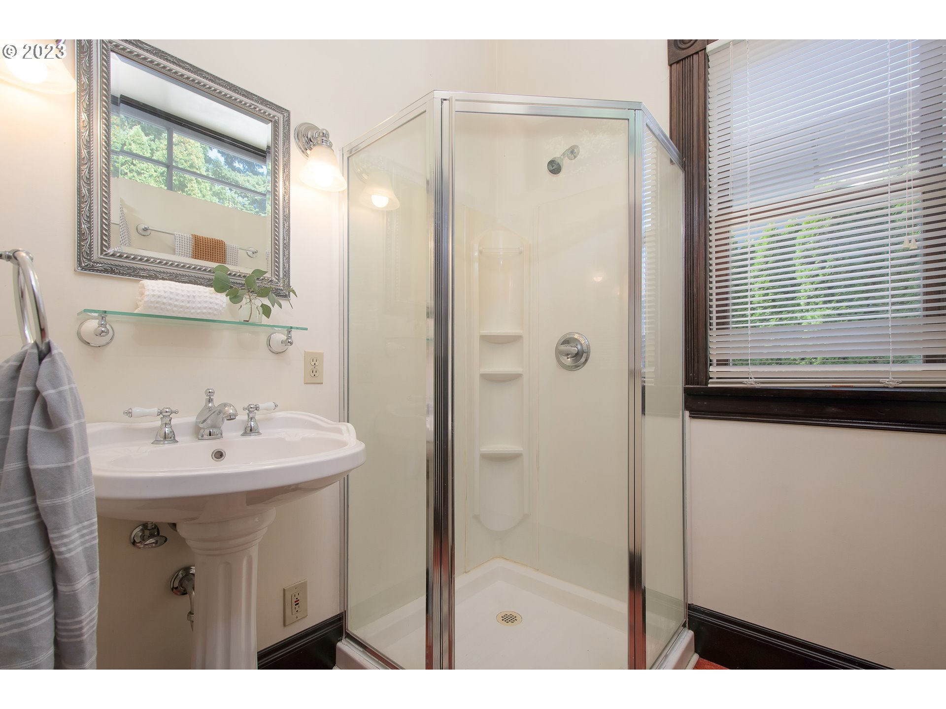 3519 Southeast Morrison Street Portland, OR 97214 - Photo 15 of 43 a bathroom with a sink mirror and a shower