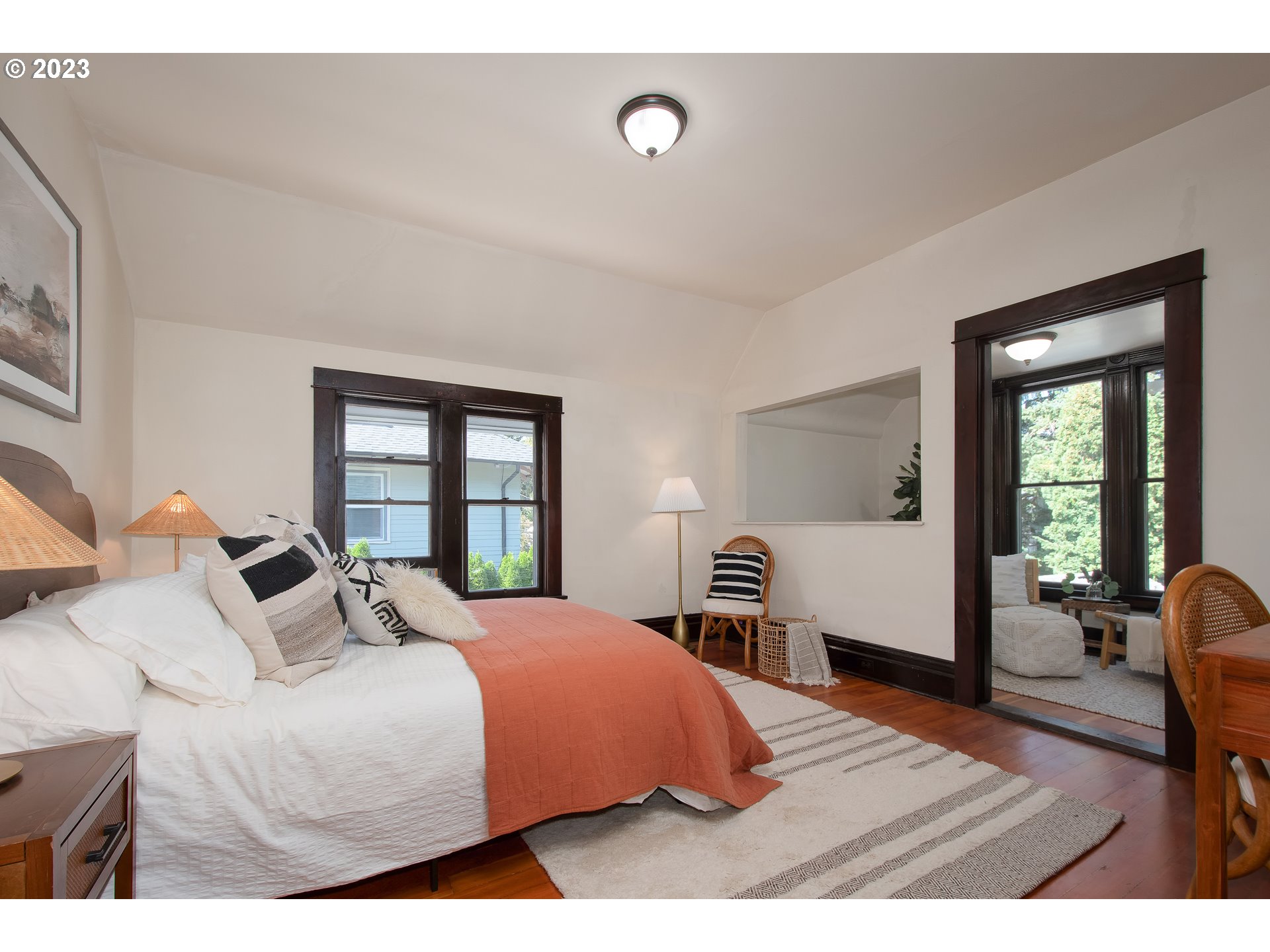 3519 Southeast Morrison Street Portland, OR 97214 - Photo 16 of 43 a bedroom with a bed and wooden floor