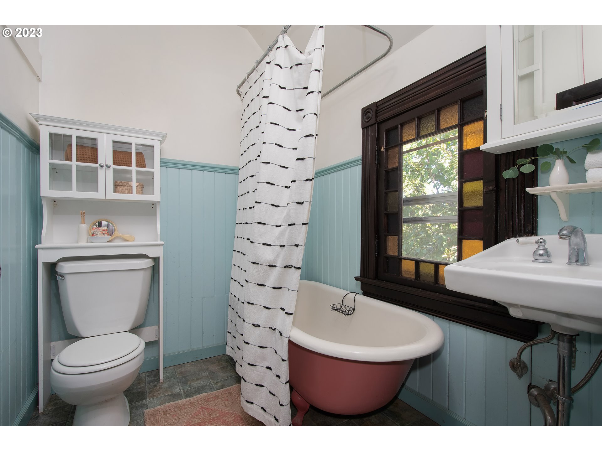 3519 Southeast Morrison Street Portland, OR 97214 - Photo 19 of 43 a bathroom with a toilet a sink and a window