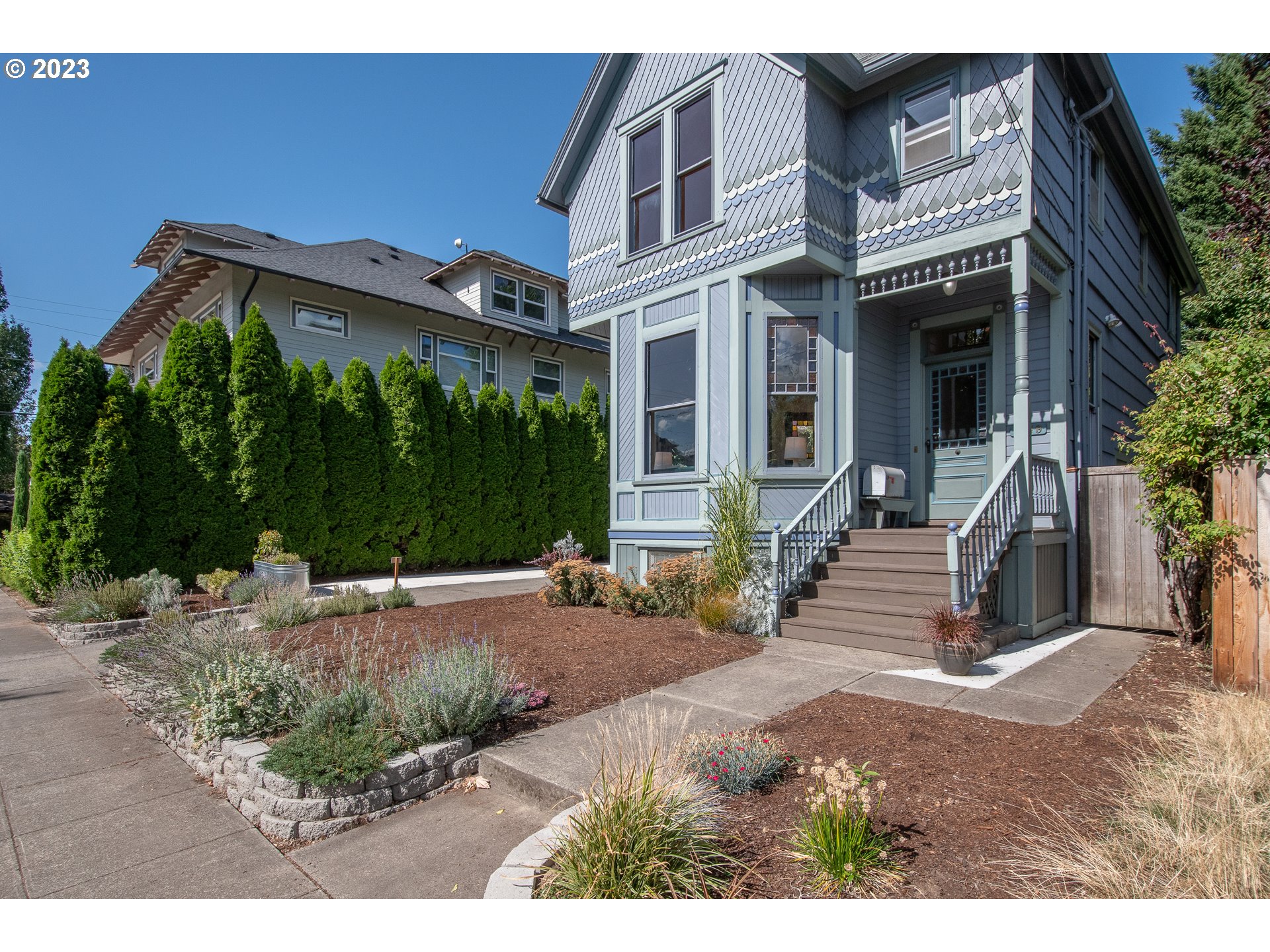 3519 Southeast Morrison Street Portland, OR 97214 - Photo 2 of 43 a view of a house with backyard and plants